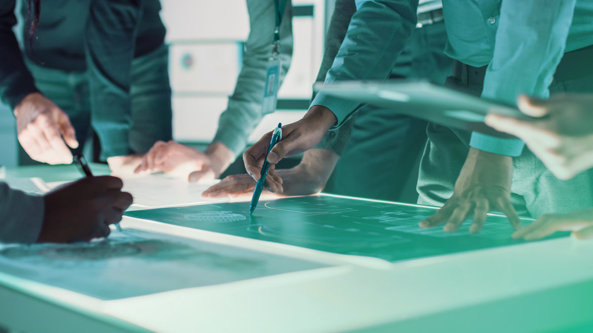 Inteb team collaborating in a professional workspace.