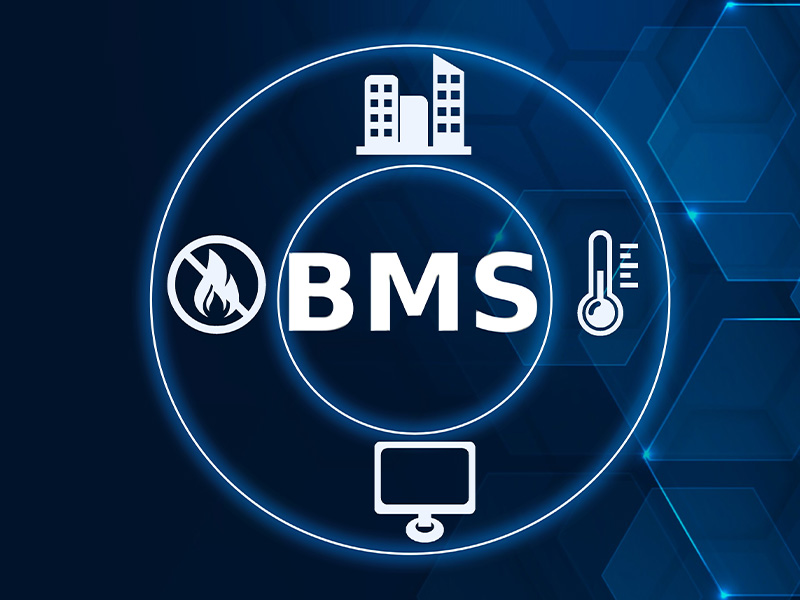 Digital graphic of a Building Management System (BMS) interface with icons for energy, temperature, fire safety, and monitoring, representing AMR energy meters and BMS audits.