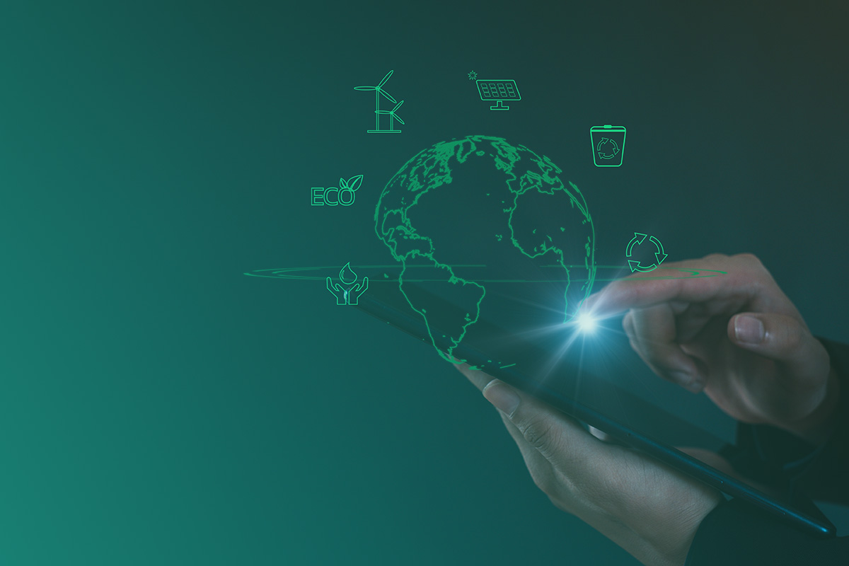 Hands interacting with a digital tablet displaying global sustainability icons, representing the importance of accurate environmental data in CCA (Climate Change Agreements) Compliance and Management Service.