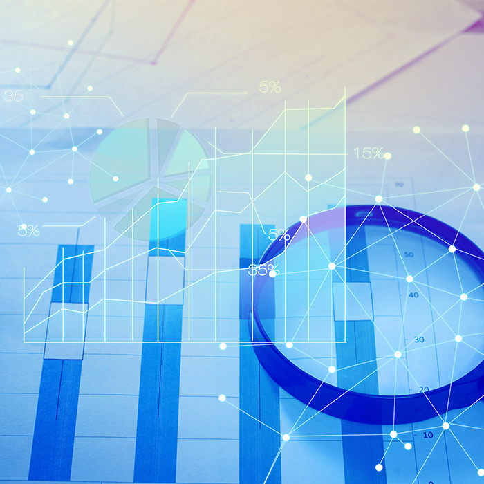 Energy audit data analysis showing charts and graphs with magnifying glass.