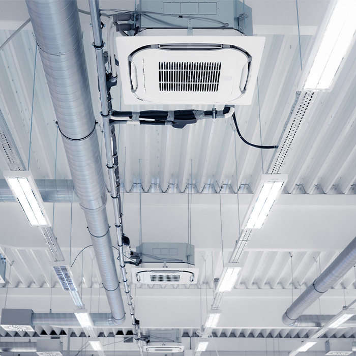Ceiling-mounted air conditioning systems subject to tm44 inspection requirements in a commercial building.