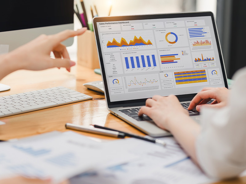 Laptop screen showing detailed graphs and data dashboards, representing the role of energy market intelligence for procurement in strategic decision-making.