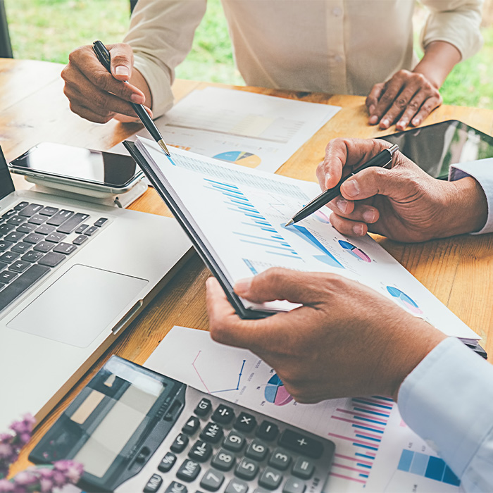 Team reviewing charts and financial data during a detailed Energy audit process.