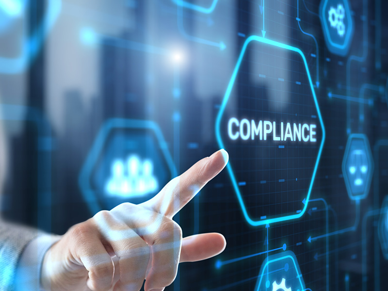 Finger pointing at digital compliance icon, symbolising how energy market intelligence for procurement ensures regulatory foresight and informed decisions.