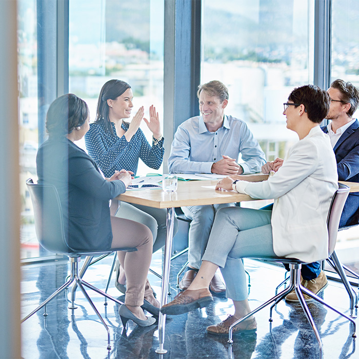 Team of professionals discussing tailored Energy audit solutions in a modern office.