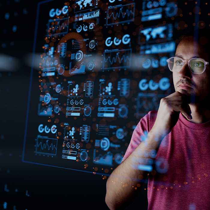 Energy management specialist analysing complex data visualisations on a digital interface.