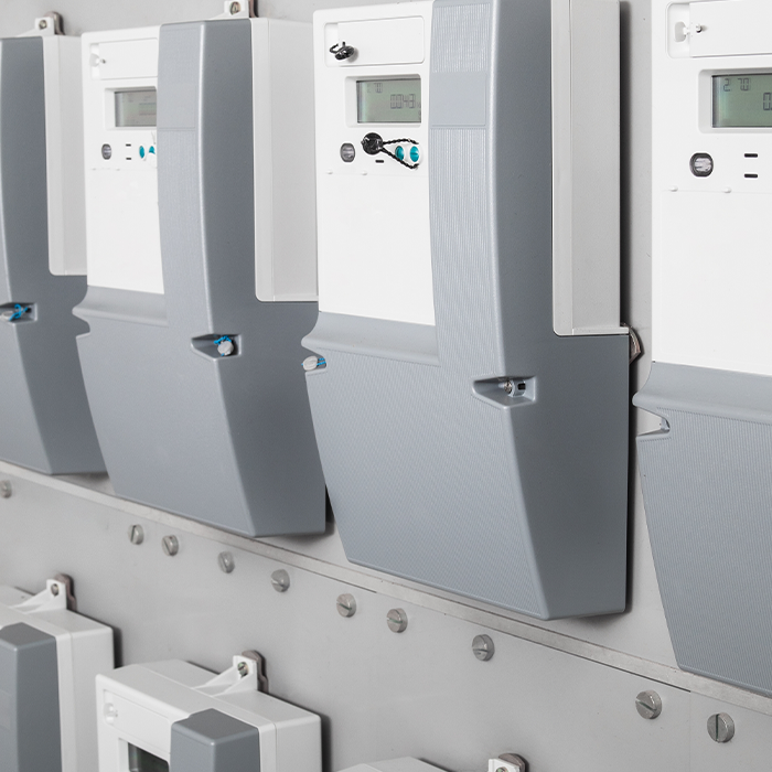 Row of electricity meters installed in a commercial setting, highlighting AMR metering technology in use.
