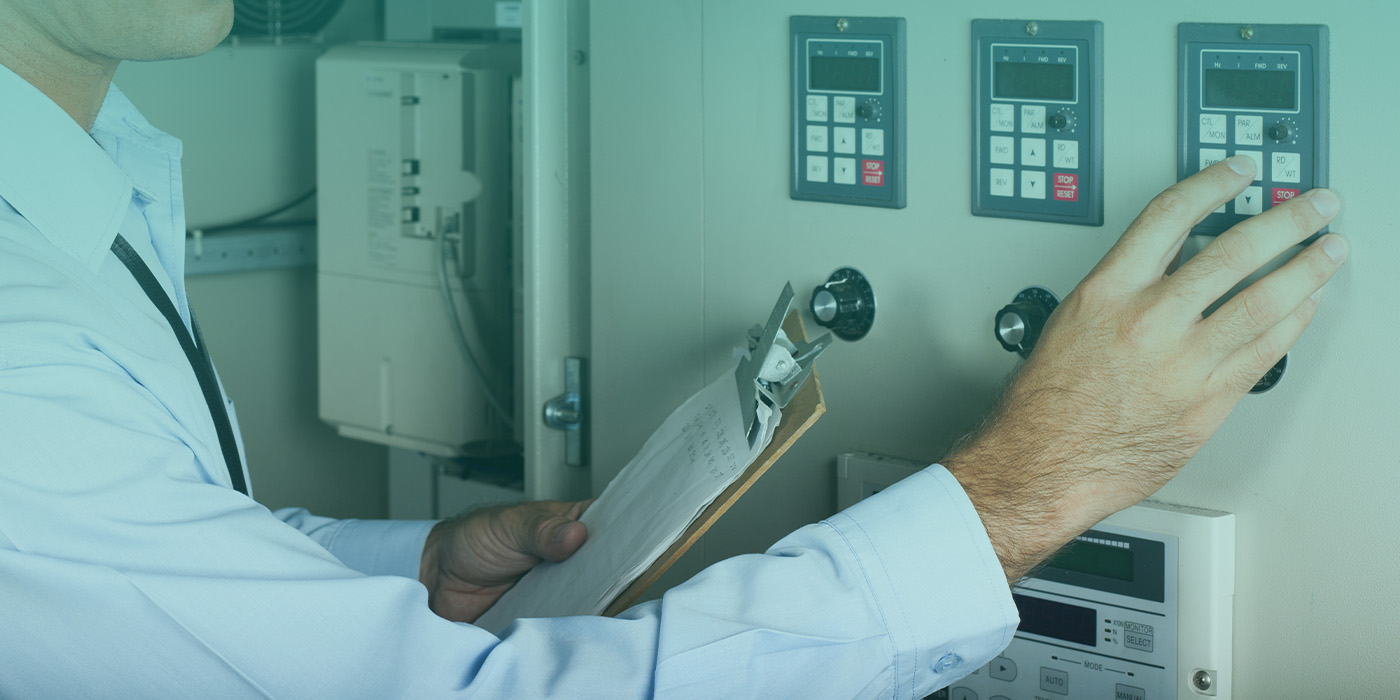 Engineer adjusting energy monitoring controls during an AMR metering installation for a national retail site.