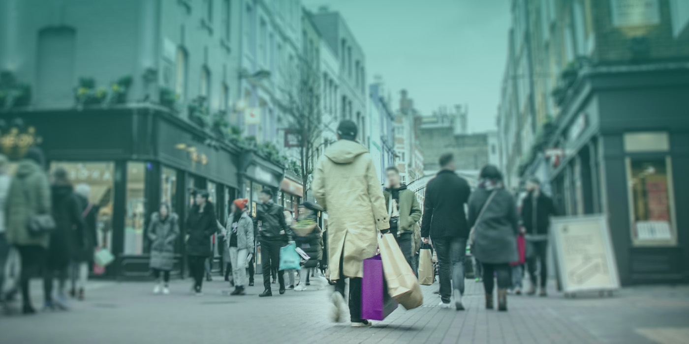 Shoppers walking through a busy retail street — reflecting a national retailer’s success in choosing the right energy provider.