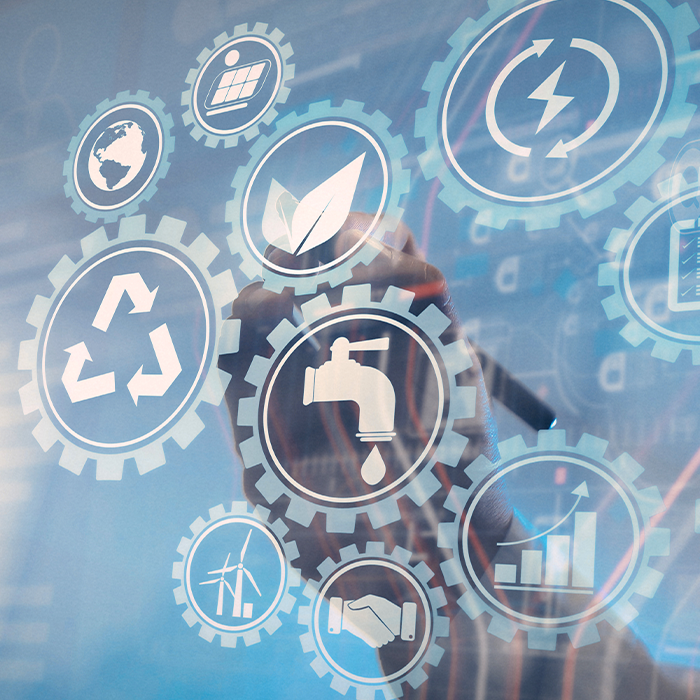 Businessperson interacting with sustainability-themed digital icons representing areas covered by SECR reporting.