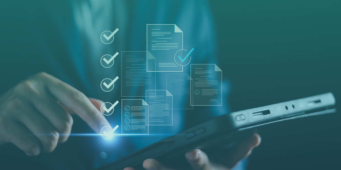 A business professional using a digital tablet to interact with compliance checklists, symbolising Preparing for ESOS Phase 4: A Complete Checklist for UK Businesses.