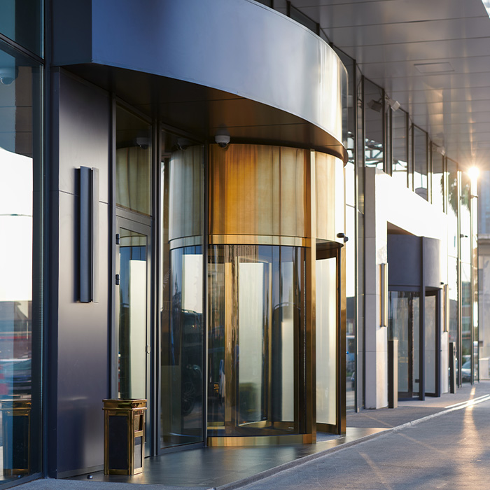 Modern commercial building entrance reflecting sustainability goals driven by net zero procurement strategies.