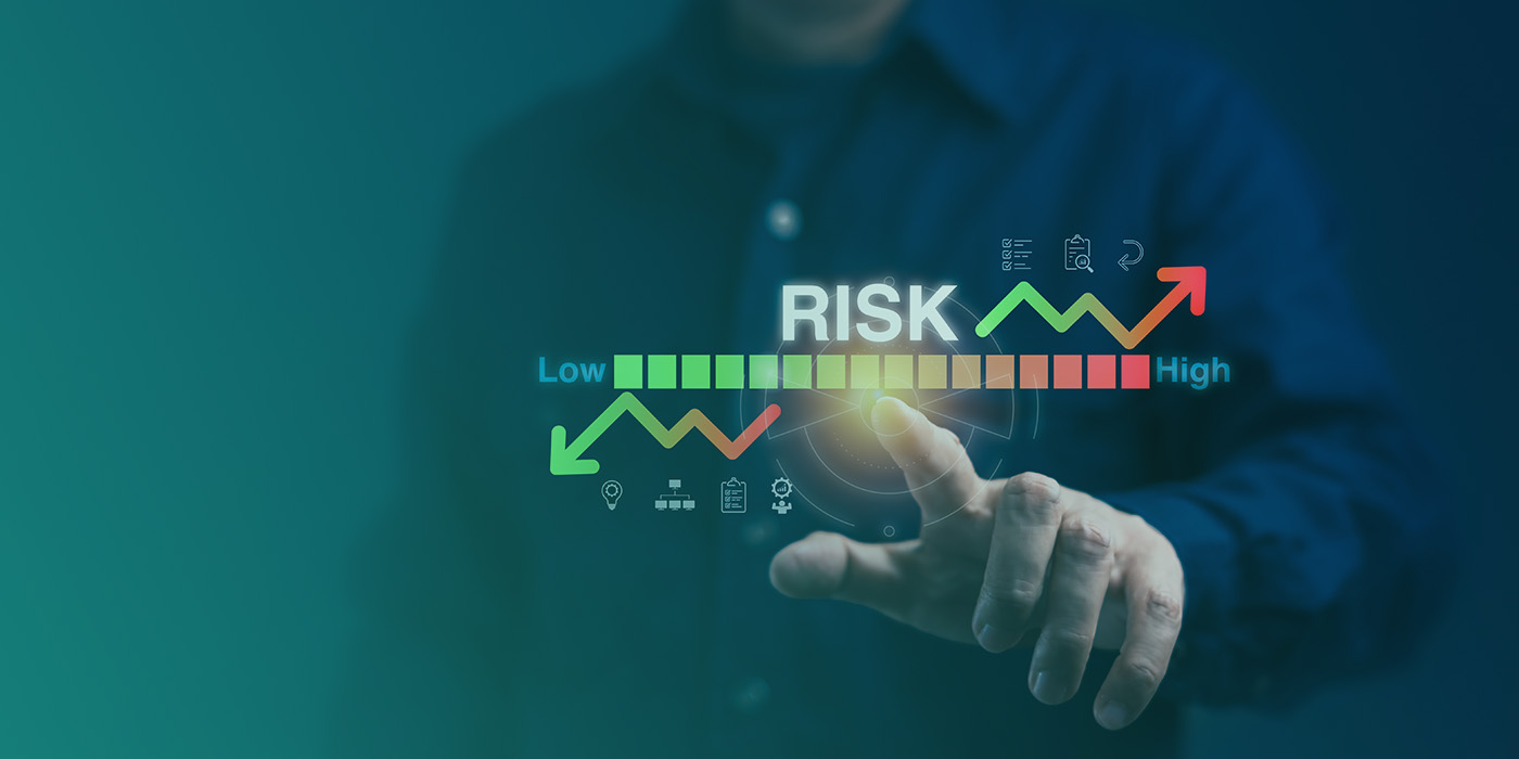 Business professional pointing at a digital risk scale, symbolising the importance of EPC accuracy for commercial buildings in reducing compliance and investment risk.