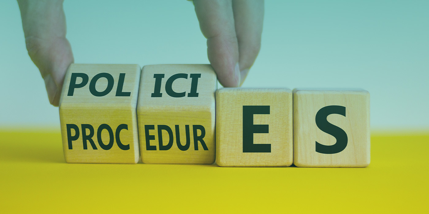 Wooden blocks showing policies and procedures, representing the regulatory framework for EPC compliance 2027.