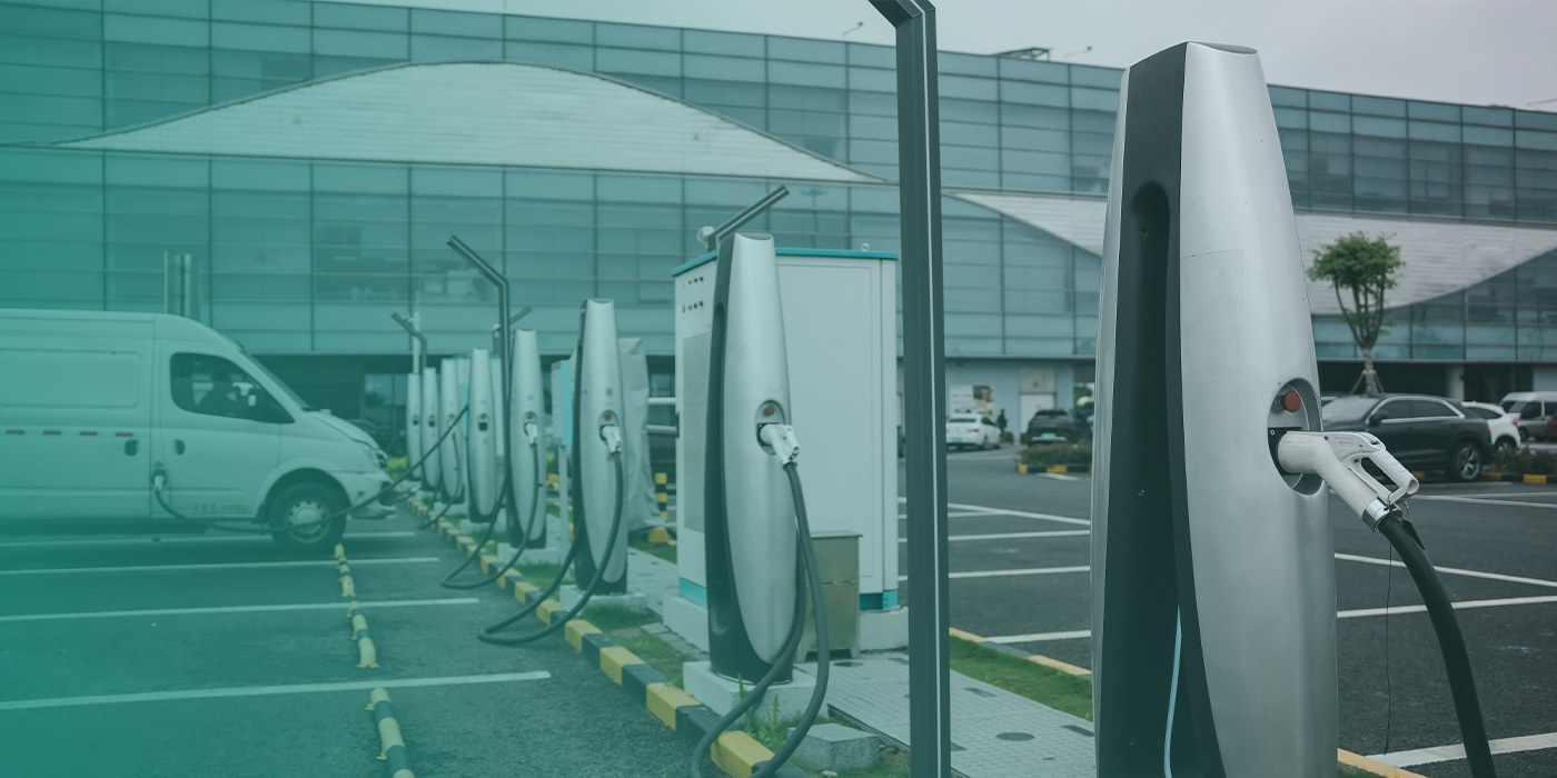 Electric vehicle charging points outside a commercial building showing the importance of coordinated utility infrastructure siteworks.