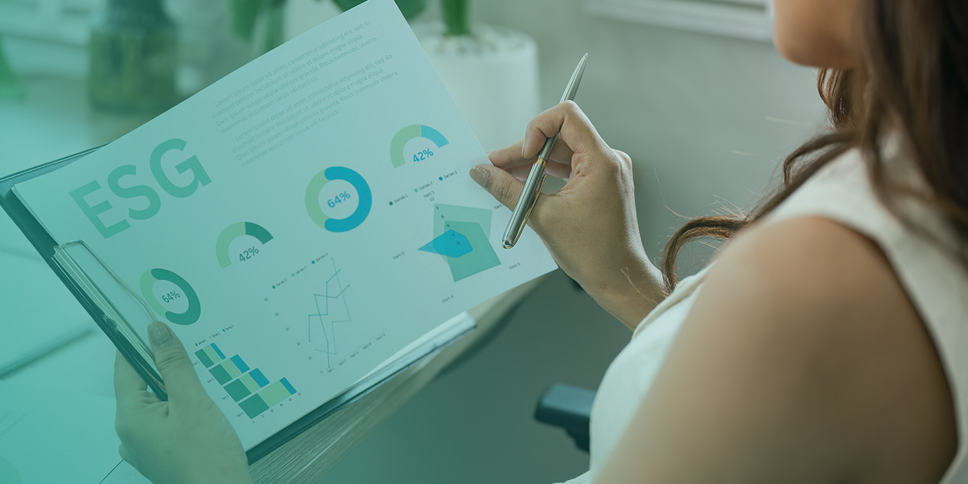 “Professional reviewing ESG charts and sustainability data, highlighting Energy Procurement Mistakes related to ignoring ESG and sustainability objectives.”