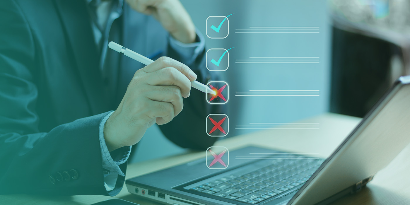 Business professional marking incorrect items on a digital checklist, symbolising issues caused by poorly managed MOP DC DA AMR Contracts.