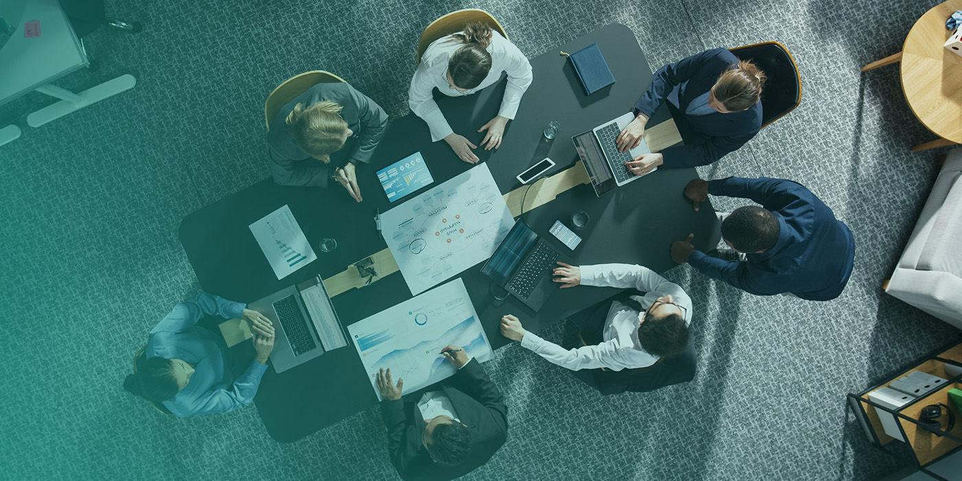 Team meeting reviewing comfort, wellbeing, and productivity data supported by an Optimised BMS.