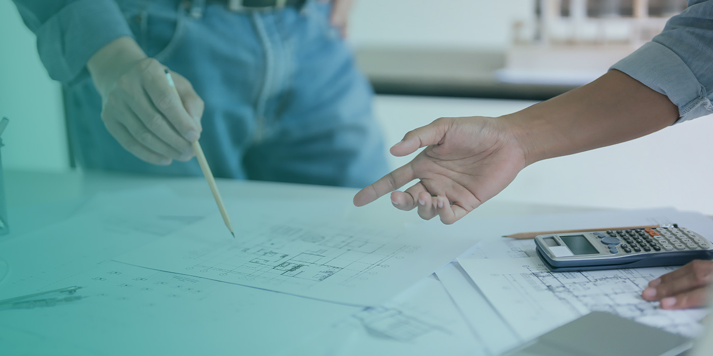 Facilities team reviewing drawings and calculations as part of a structured BMS Recommissioning process.