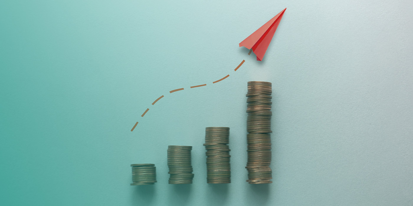 Rising stacks of coins and an upward arrow showing how costs can increase within Fixed Energy Tariffs Multi Site Portfolios over time.
